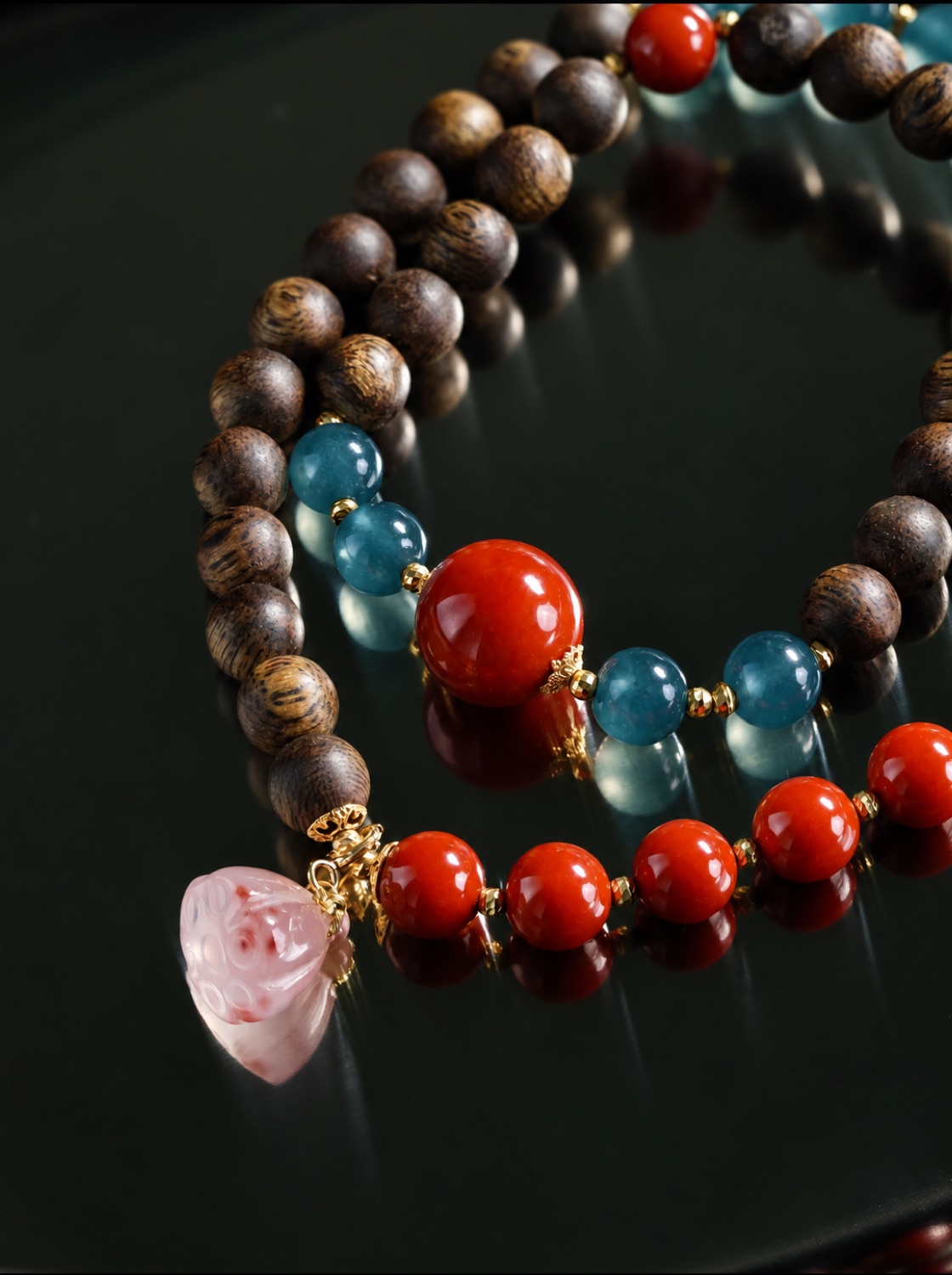 No. 03, Vermilion, blue-teal, deep brown, a pale pink drop